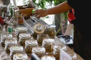 Different types of cannabis buds in a glass jar, medicinal marijuana